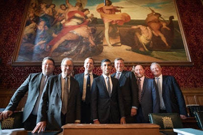 Rishi Sunak (centre) meeting with members of the 1922 Committee in the Houses of Parliament, London ...