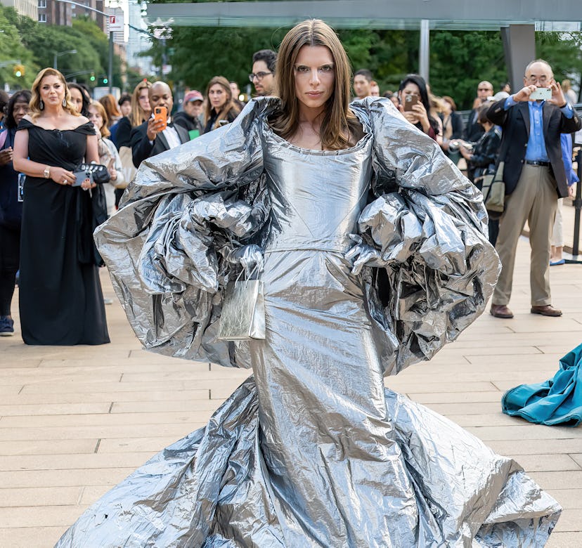 Julia Fox wearing a silver foil gown by Zac Posen.