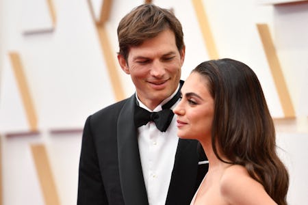 US actor Ashton Kutcher (L) and wife US actress Mila Kunis attend the 94th Oscars at the Dolby Theat...