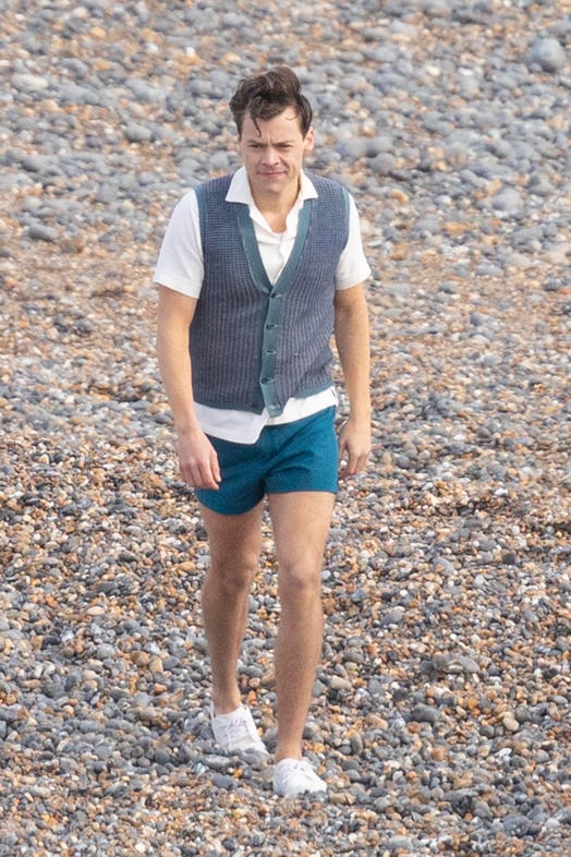 Harry Styles captured walking with his tattoos covered up on the set of "My Policeman".