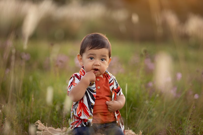 Cute one year-old latin american boy playing outdoors in piece about boy names that start with I
