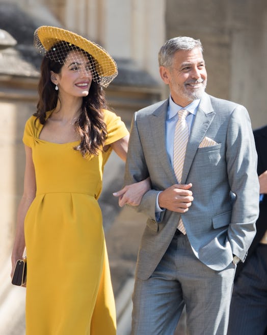 WINDSOR, ENGLAND - MAY 19: George Clooney and Amal Clooney attend the wedding of Prince Harry to Ms…