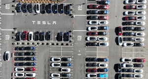 FREMONT, CALIFORNIA - OCTOBER 19: In an aerial view, brand new Tesla cars sit in a parking lot at th...