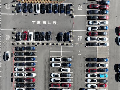 FREMONT, CALIFORNIA - OCTOBER 19: In an aerial view, brand new Tesla cars sit in a parking lot at th...