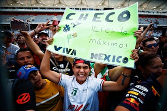 AUSTIN, TEXAS - OCTOBER 23: Sergio Perez of Mexico and Oracle Red Bull Racing fans show their suppor...