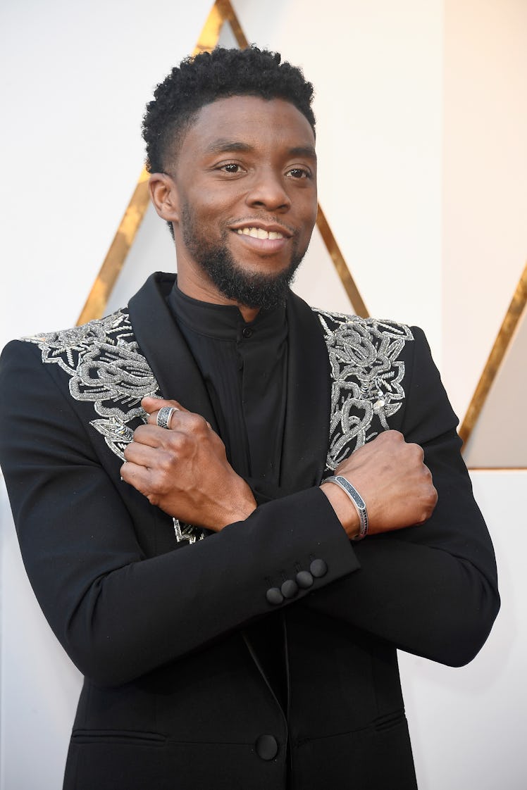 Chadwick Boseman holds the "Wakanda Forever" pose at the 90th Annual Academy Awards at Hollywood & H...