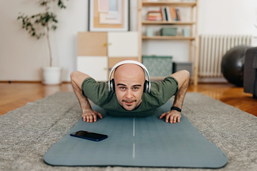 A man doing pushups at home.