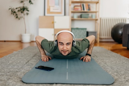 A man doing pushups at home.