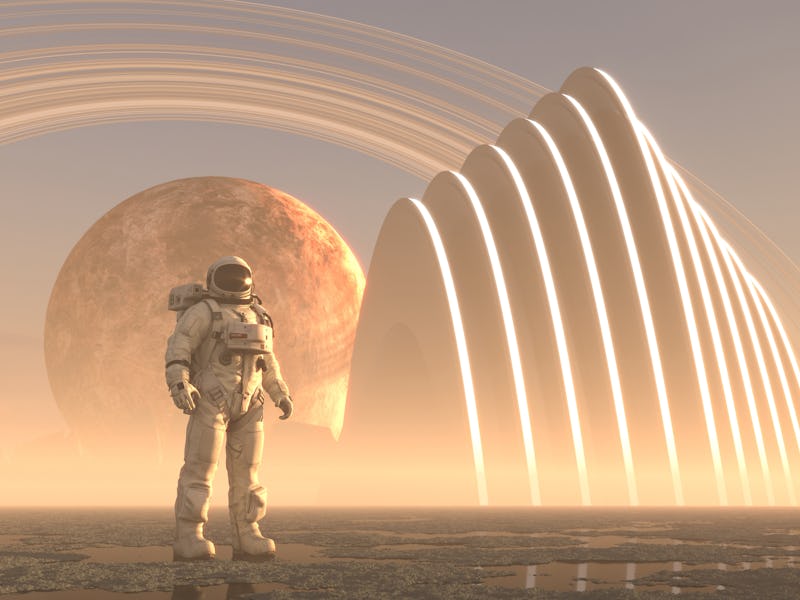 Astronaut in front of an alien structure on remote planet