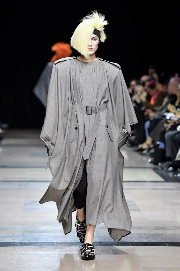 A model wearing Junya Watanabe’s gray maxi coat dress at Paris Fashion Week Spring 2023