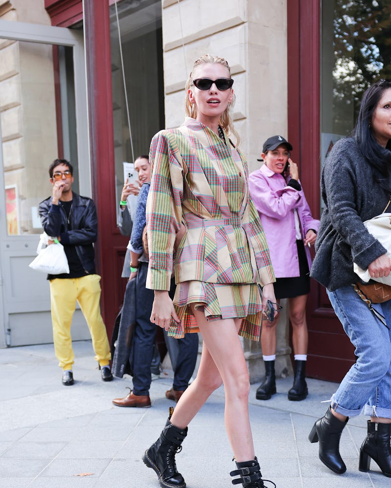 Stella Maxwell attends the Vivienne Westwood Womenswear Spring/Summer 2023 show wearing boots