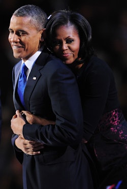 US President Barack Obama and his wife Michelle celebrate on stage after Obama delivered his accepta...