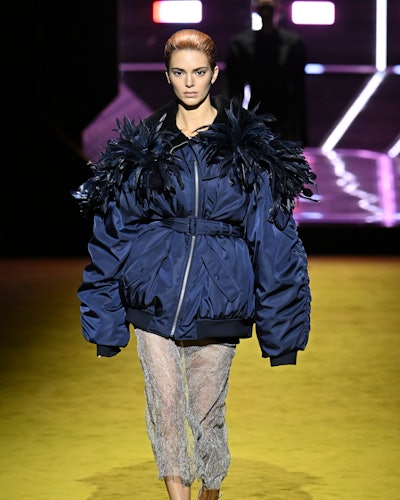 Kendall Jenner walks the runway in a bomber jacket