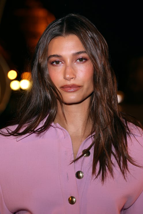 Hailey Bieber wore plum lips and a black manicure over the weekend.