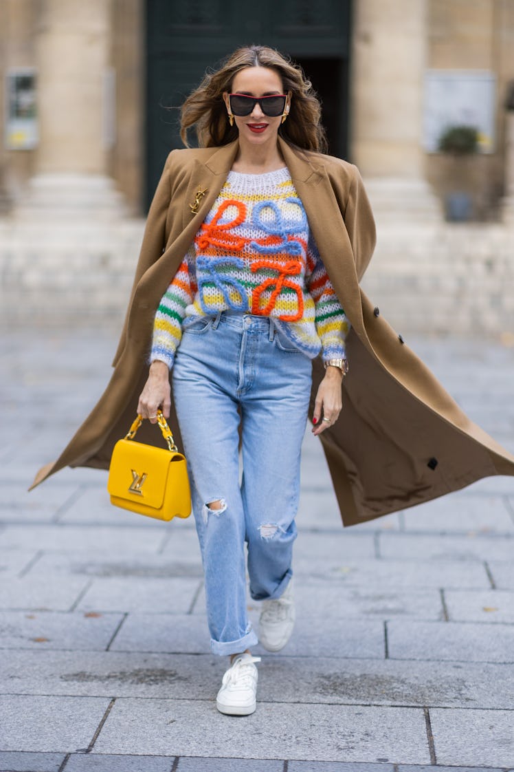 Wearing fall 2022 fashion trends for yellow auras, Alexandra Lapp wears Medeea long coat in beige, A...
