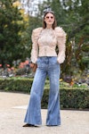 Wearing fall fashion trends for pink auras, Ophelie Guillermand is seen wearing a cream Zimmermann r...