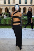 Doja Cat's blue face paint at Paris Fashion Week as seen while she attends the Monot Womenswear Spri...