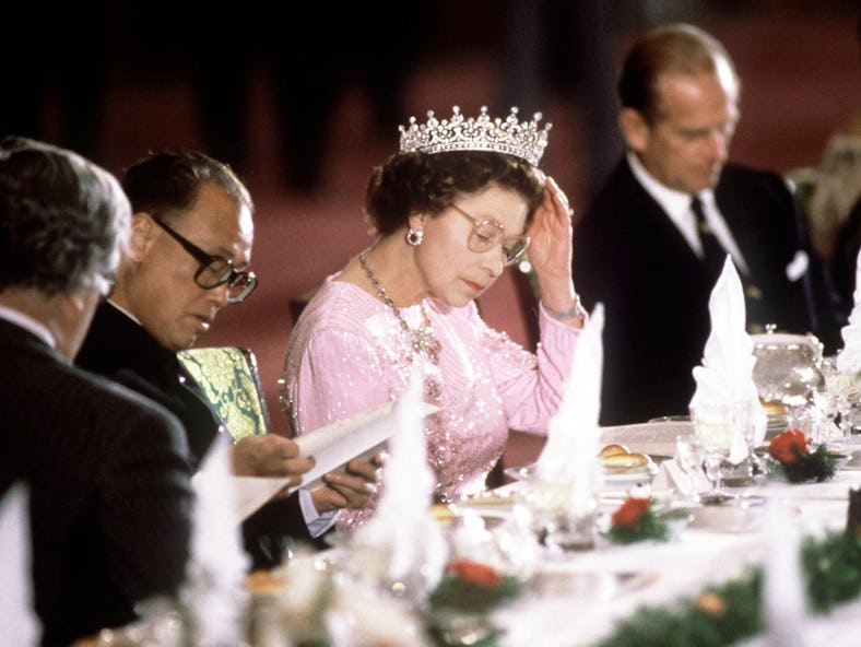 Queen Elizabeth II wearing the crown jewels as seen when the Queen was adjusting Her Tiara Whilst Re...