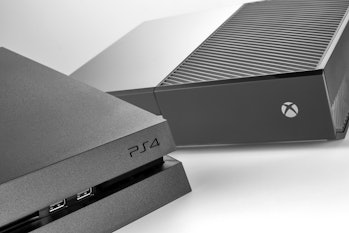 A Sony PlayStation 4 (L) and Microsoft Xbox One home video game console, taken on January 22, 2016. ...