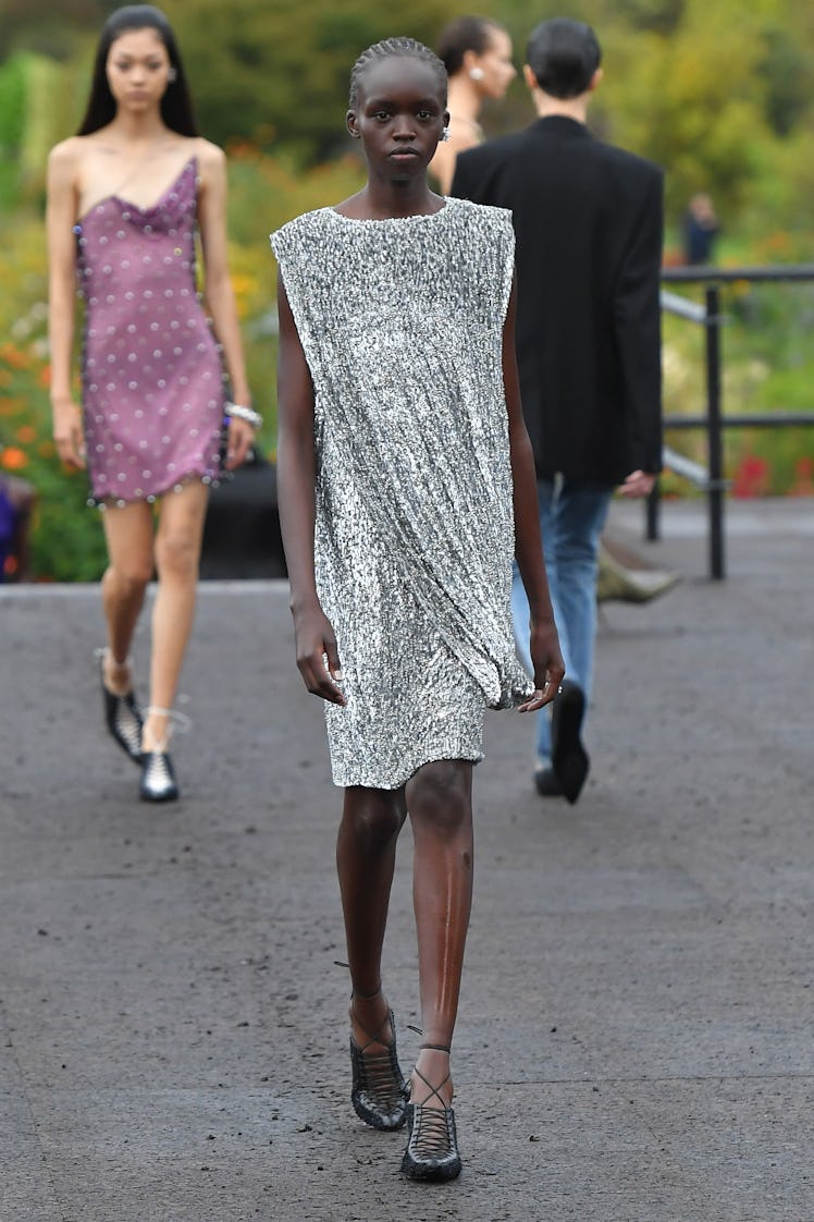 A model wearing Givenchy’s knee-high silver sequin dress at Paris Fashion Week Spring 2023