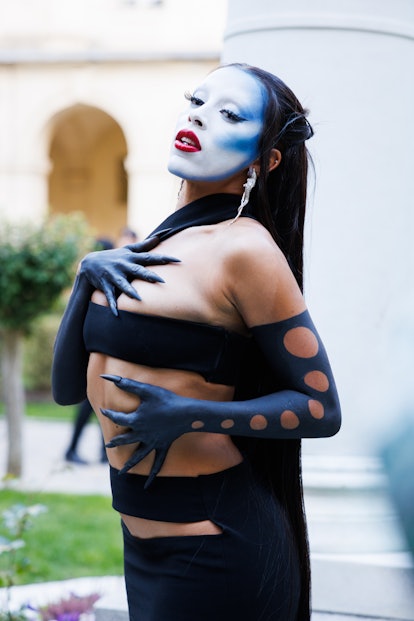 Doja Cat's blue face paint at Paris fashion week seen as she attends the Monot Womenswear Spring/Sum...