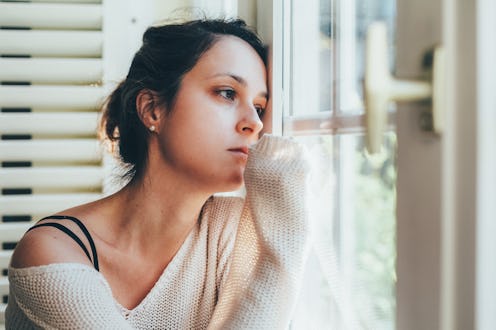 Thoughtful woman at home