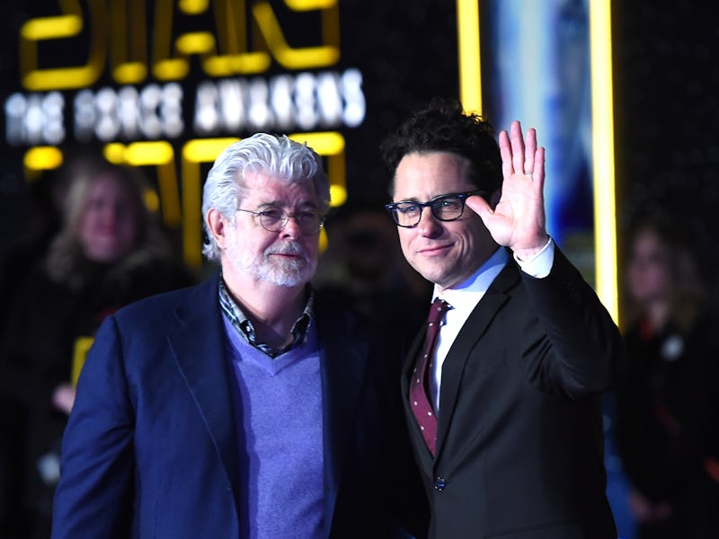 HOLLYWOOD, CA - DECEMBER 14: Filmmaker George Lucas (L) and writer-director J.J. Abrams attend the ...