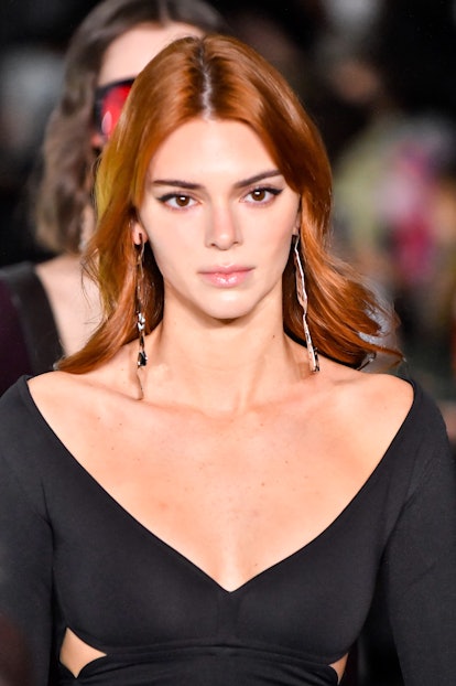 Kendall Jenner wearing kitten liner, the 2022 holiday beauty trend for Taurus, walks the runway duri...