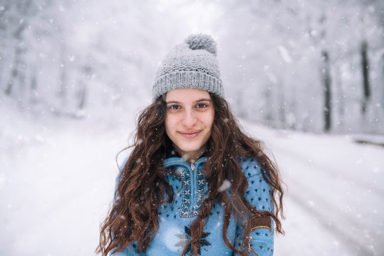 Portrait of a smiling beautiful woman in winter.