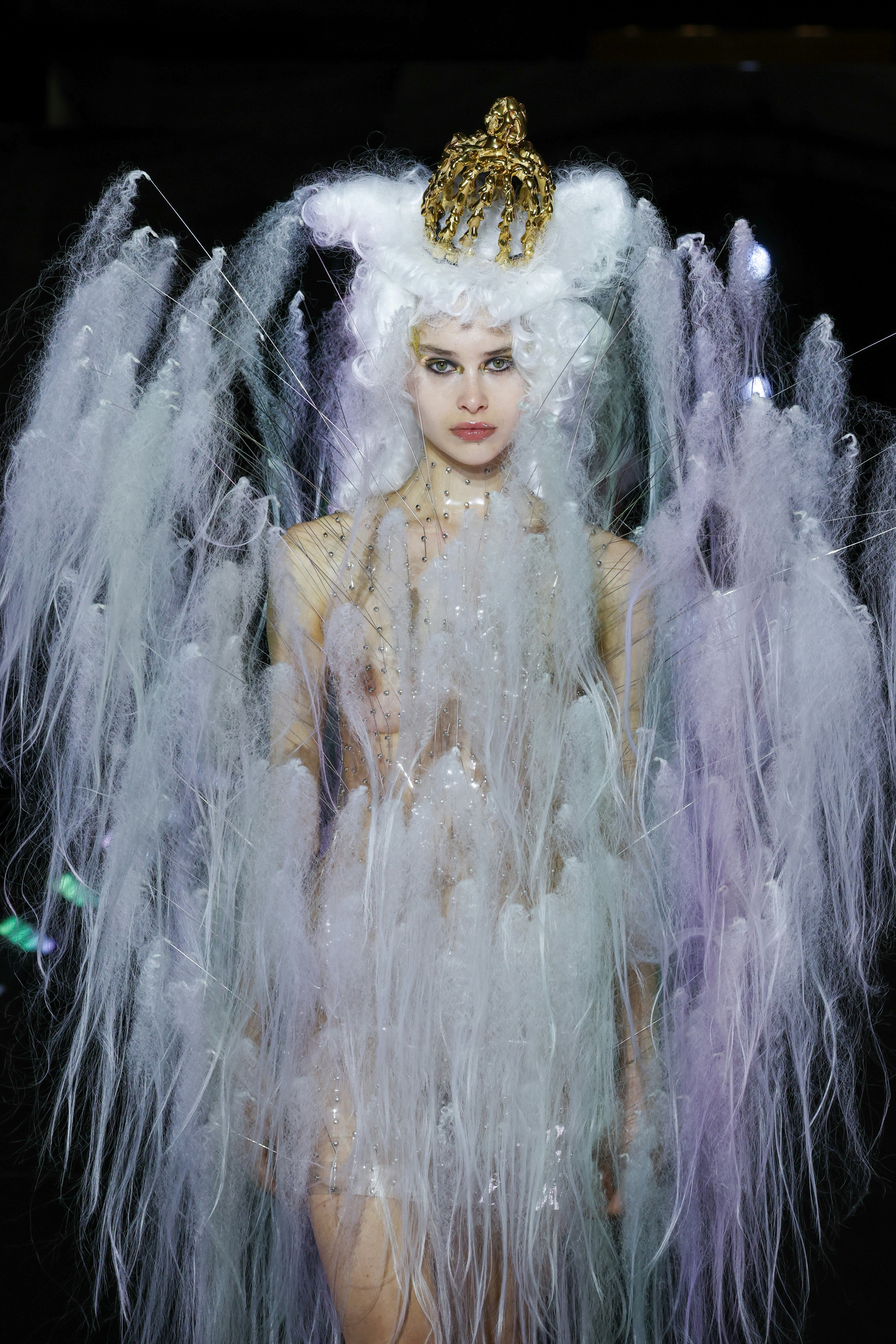 Weird Paris Fashion Week makeup includes the look seen on a model walking the runway during the Noir...