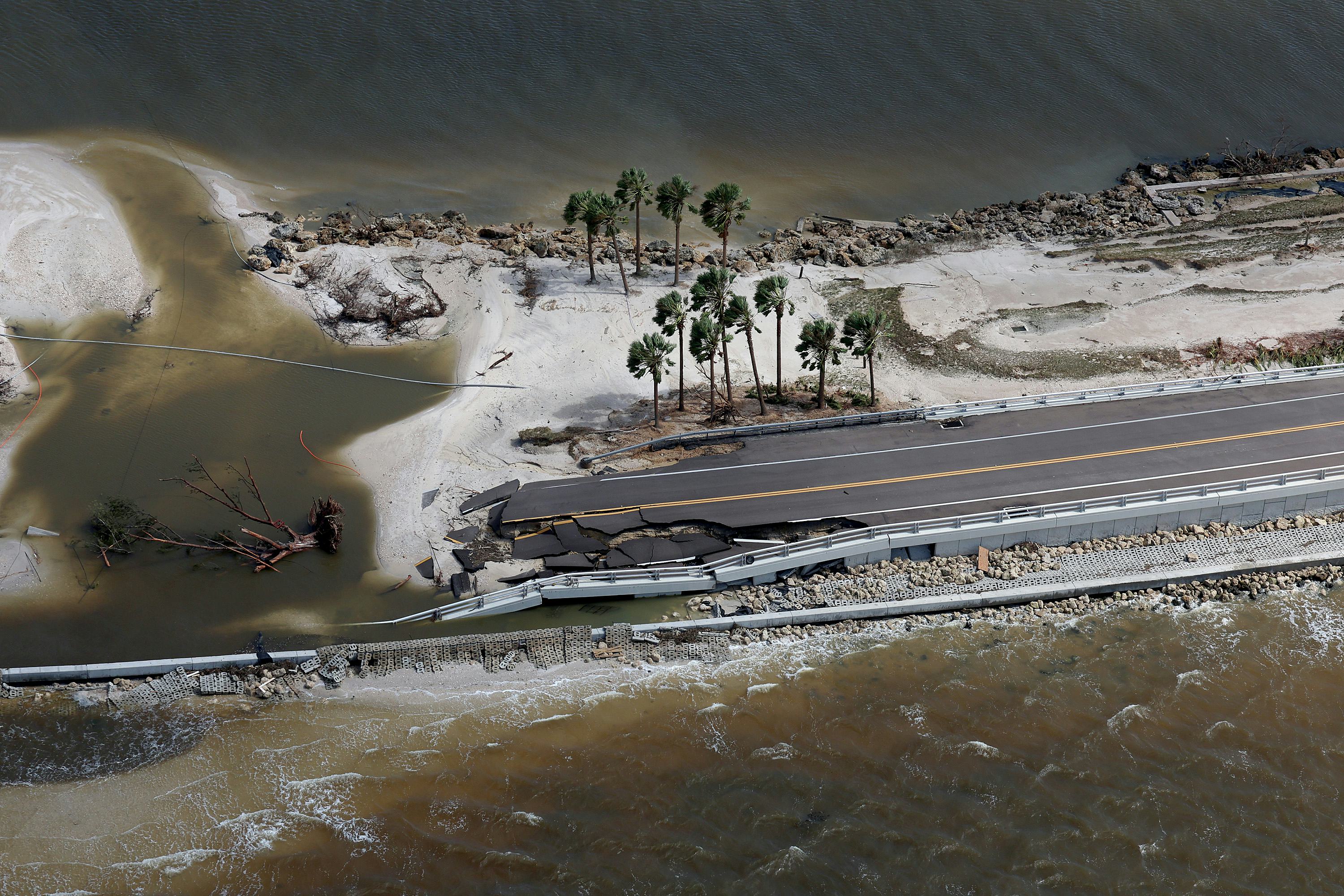 SANIBEL, FLORIDA - SEPTEMBER 29: In this aerial view, parts of Sanibel Causeway are washed away alon...