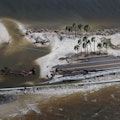 SANIBEL, FLORIDA - SEPTEMBER 29: In this aerial view, parts of Sanibel Causeway are washed away alon...