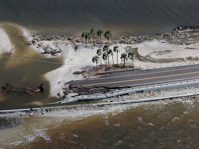 SANIBEL, FLORIDA - SEPTEMBER 29: In this aerial view, parts of Sanibel Causeway are washed away alon...