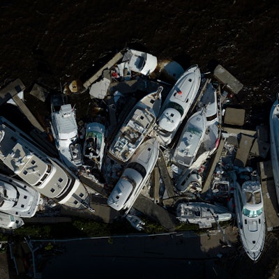 TOPSHOT - An aerial view taken on September 29, 2022 shows piled up boats in the aftermath of Hurric...
