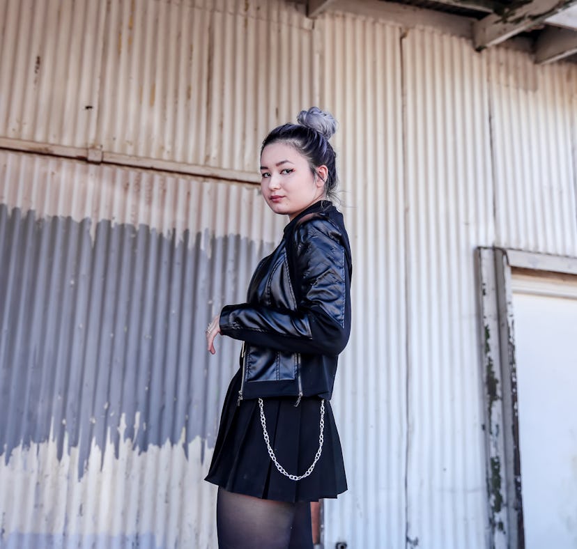 A teenager shows off her throwback pics with captions for teenage dirtbag pics on Instagram.