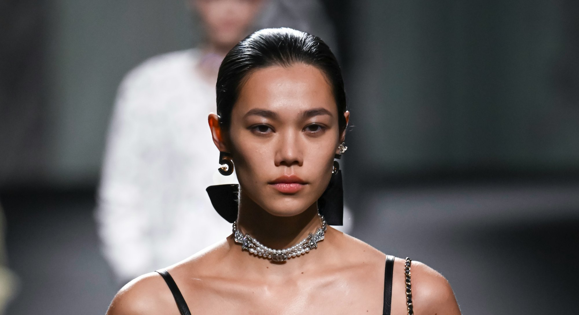 PARIS, FRANCE - OCTOBER 04: A model walks the runway during the Chanel Ready to Wear Spring/Summer 2...