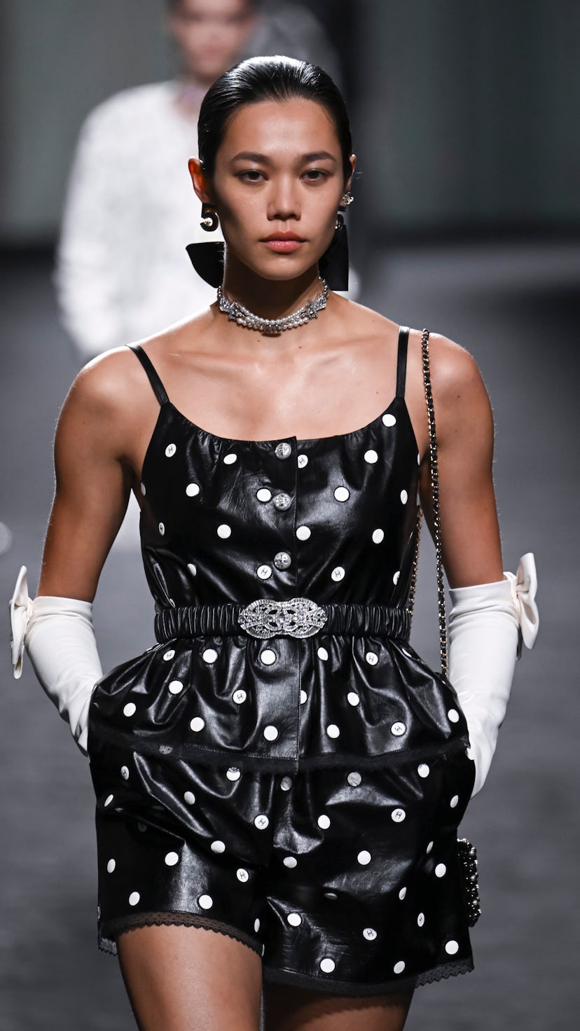 PARIS, FRANCE - OCTOBER 04: A model walks the runway during the Chanel Ready to Wear Spring/Summer 2...