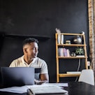 Young professional man working in modern office space