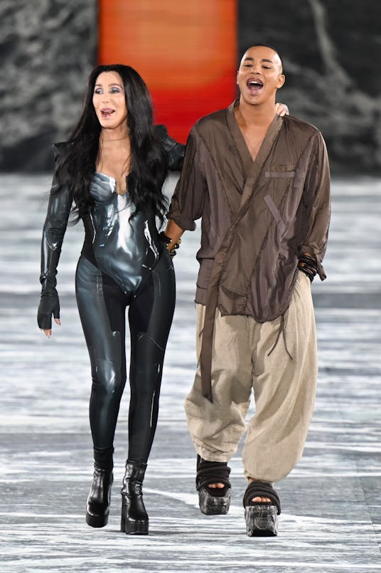 Singer Cher and Fashion designer Olivier Rousteing walk the runway during the Paris Fashion Week