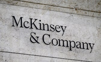 This photograph taken on April 12, 2022, shows a sign of US-based McKinsey & Company management cons...