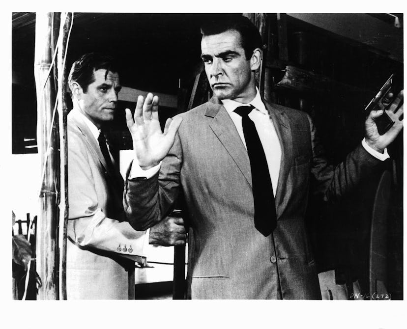 Sean Connery held at gunpoint by Jack Lord in a scene from the film 'James Bond: Dr. No', 1962. (Pho...