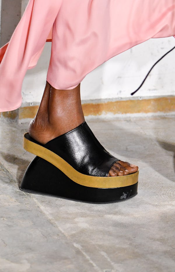 A model walks the runway during the Dries Van Noten Ready to Wear Spring/Summer 2023 fashion show we...