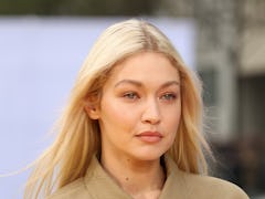 Gigi Hadid reportedly still has her "walls up" with Leonardo DiCaprio.