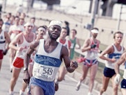 View of a New York City Marathon runner as he makes his way across the Verrazzano-Narrows Bridge, Br...