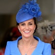 Kate Middleton wearing a blue coat dress.