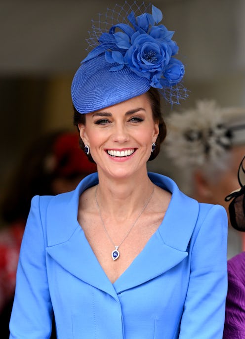 Kate Middleton wearing a blue coat dress.