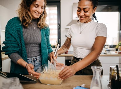 Two woman learn how to make the pancake spaghetti TikTok recipe for breakfast. 