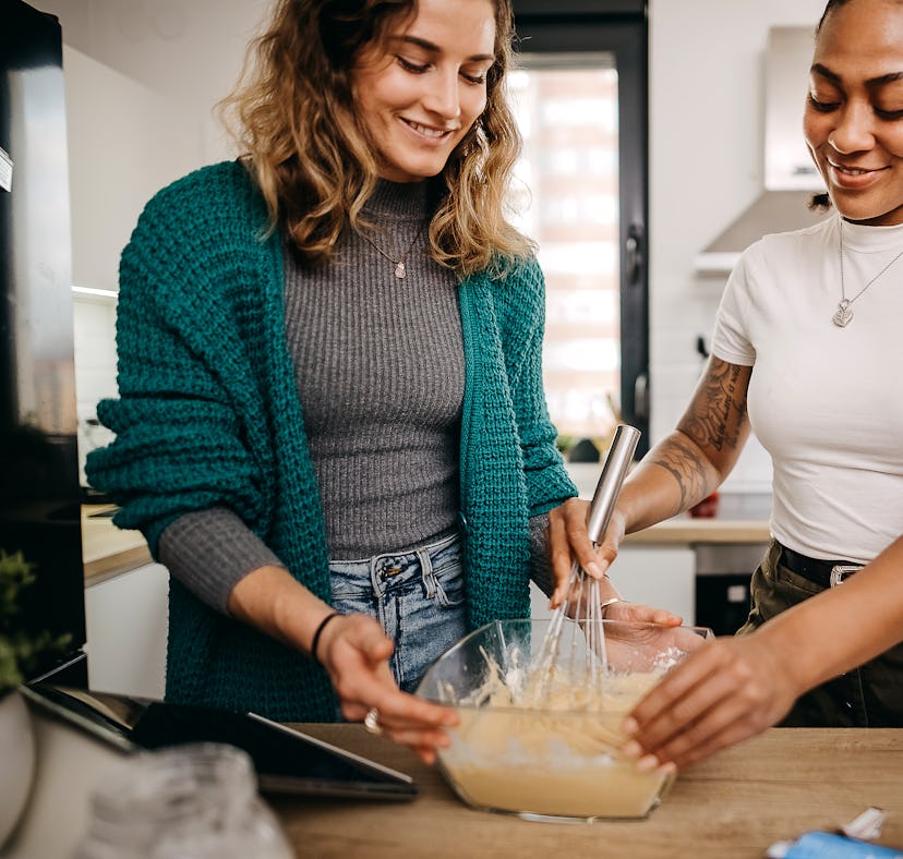 Two woman learn how to make the pancake spaghetti TikTok recipe for breakfast.