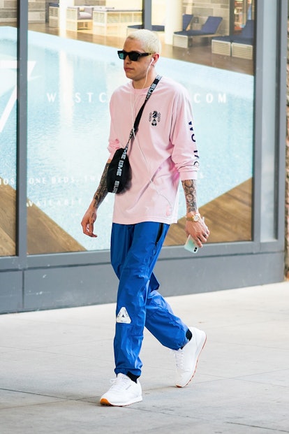 Pete Davidson Style Evolution: Pete Davidson was spotted in blue joggers and a light pink zhirt seen...