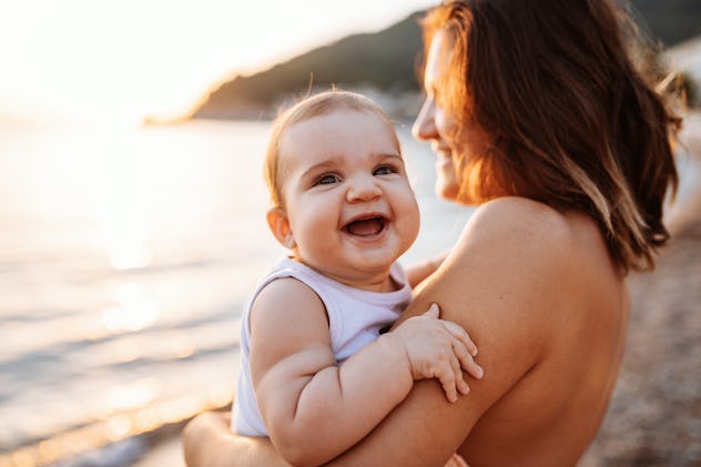 Mother and baby girl outdoors in summer in a round up of girl names that start with H